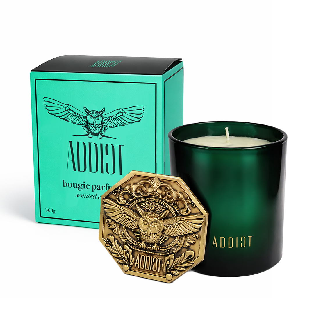 ADDICT 360g luxury soy candle with its gold owl emblem lid and turquoise gift box
